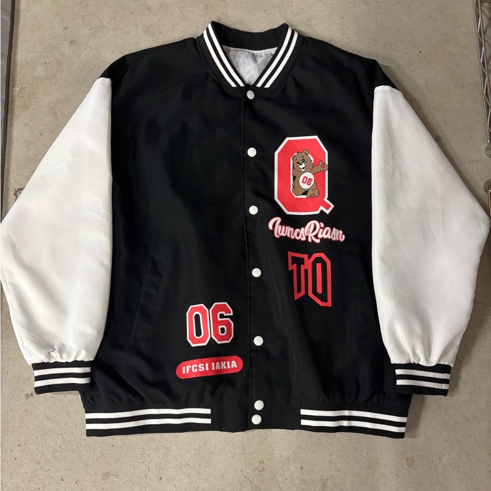 Black varsity jacket with red font and design